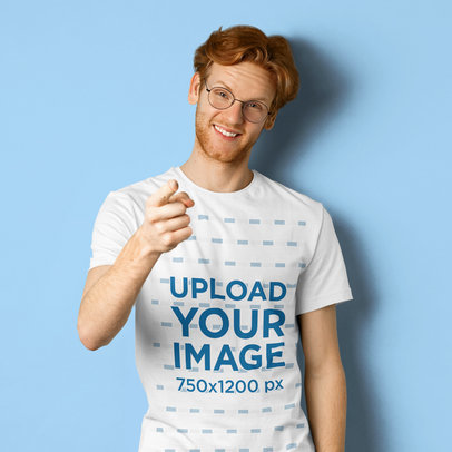 Studio Mockup of a Red-Haired Man Wearing a T-Shirt and Glasses