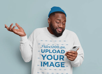 Sweatshirt Mockup of an Indifferent Man Checking His Phone