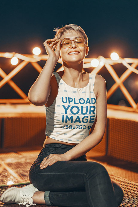 Tank Top Mockup of a Smiling Woman with Sunglasses Posing on a Terrace