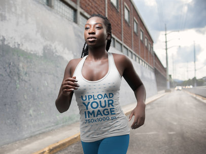 Tank Top Mockup Being Worn by a Running Woman with Dreadlocks at an Industrial Zone a16748