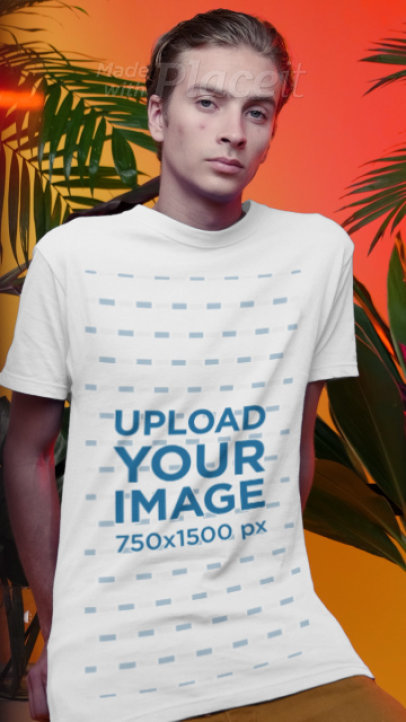 T-Shirt Video Featuring a Man Posing by Some Tropical Plants