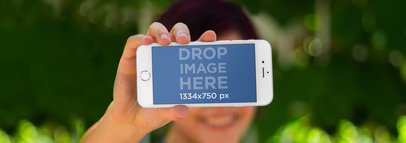 Woman Holing iPhone 6 Frontal Shot Bokeh Wide