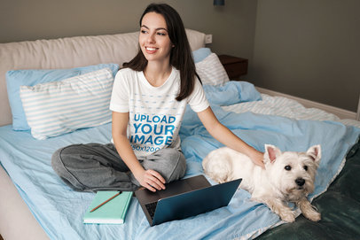Round-Neck Tee Mockup of a Woman in Bed Petting Her Dog