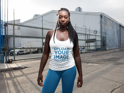 Girl With Dreadlocks Wearing Tank Top Mockup in an Industrial Area a16745