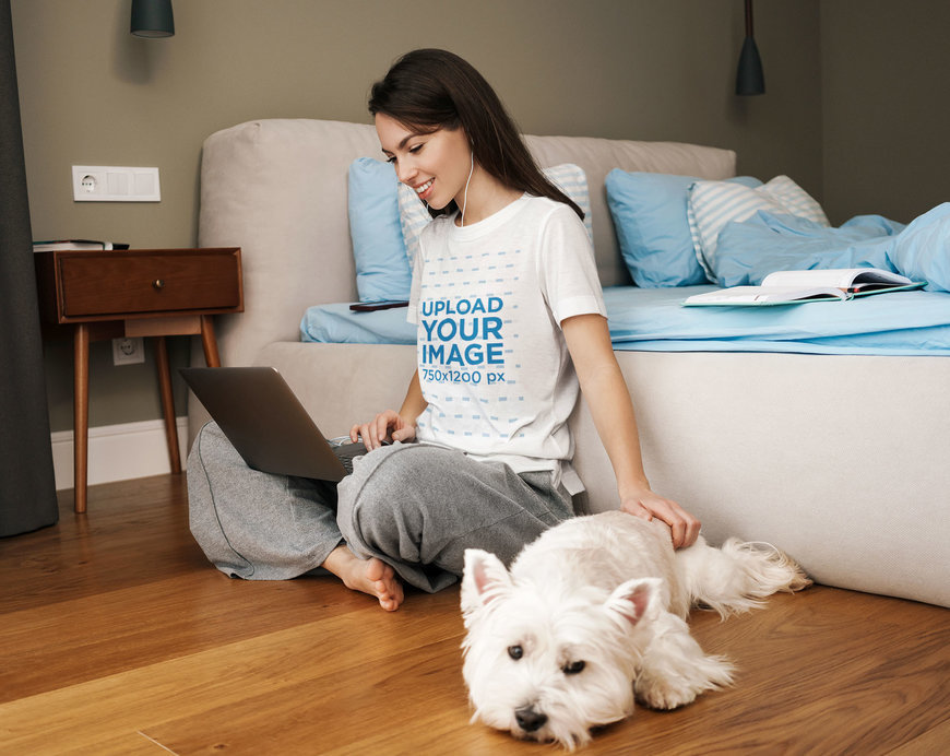 T-Shirt Mockup Featuring a Woman Using Her Computer Next to Her Dog