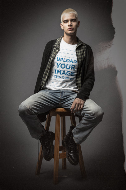 Bella Canvas T-Shirt Mockup Featuring a Serious Man Sitting on a Stool 