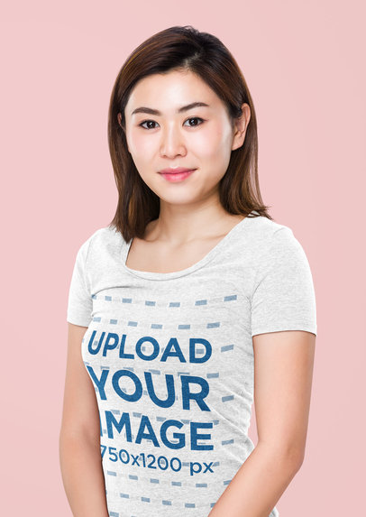 Mockup of a Short-Haired Woman Posing with a Heather Tee in a Studio