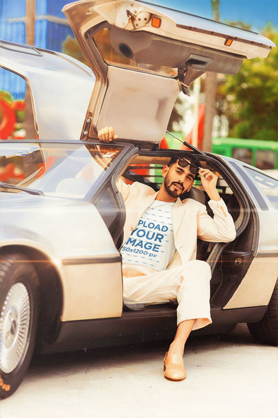 T-Shirt Mockup of a Stylish Man in a Retro Gull-Wings Doors Car
