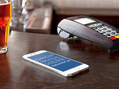 Mockup of an iPhone 6 At Counter Bar