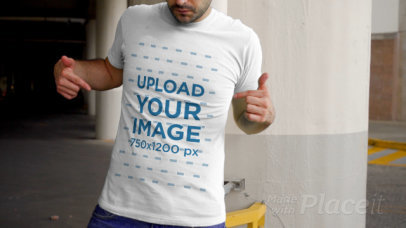 Video of a Man Pointing at His T-Shirt in a Parking Lot 3696v