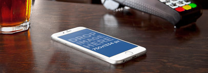 Wide Mockup of an iPhone 6 At Counter Bar