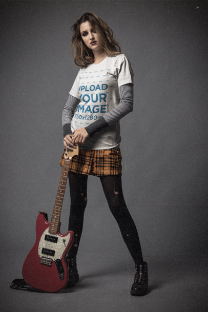 Bella Canvas T-Shirt Mockup of a Young Woman Posing With an Electric Guitar 