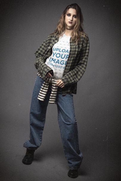 Grunge-Styled Mockup Featuring a Serious Woman Wearing a Bella Canvas T-Shirt 