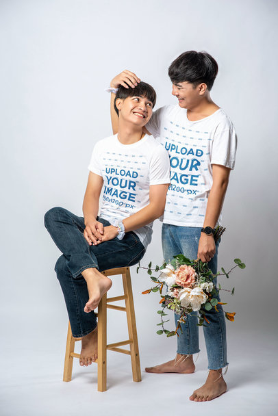 T-Shirt Mockup Featuring a Man With Flowers Smiling to His Partner