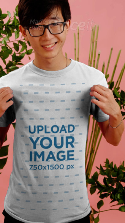 T-Shirt Video Featuring a Young Man and Plants in the Background