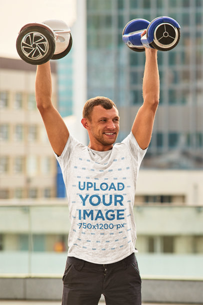 T-Shirt Mockup of a Man Holding Two Hoverboards m8275-r-el2