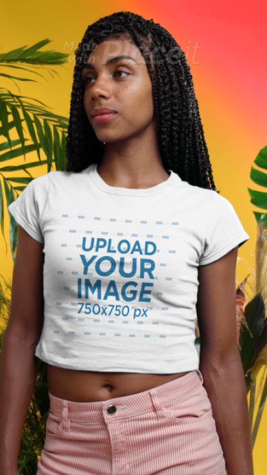Crop Top Video of a Woman with Braids by Palm Tree Leaves