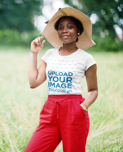 T-Shirt Mockup of a Classy Woman Posing Outdoors