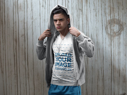 Sleeveless Shirt Mockup of a Young Man Wearing Custom Sportswear While Against a Dirty Concrete Wall