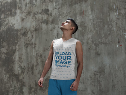 Mockup of a Young Man Wearing a Sleeveless Shirt While Looking to the Sky