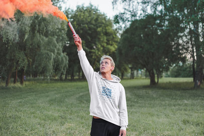 Pullover Hoodie Mockup of a Man Holding a Flare  m8578 r-el2