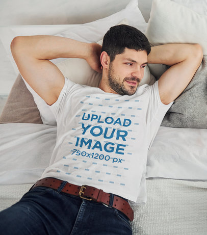 T-Shirt Mockup of a Bearded Man Lying on His Bed 
