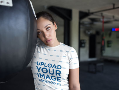 Sports Mockup of a Beautiful Woman Resting at the Gym While Wearing Custom Sportswear
