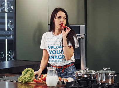 T-Shirt Mockup of a Woman Eating Veggies While Cooking m8825-r-el2