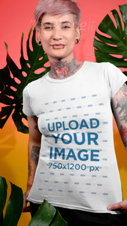 T-Shirt Video of a Tattooed Woman Posing by Palm Leaves