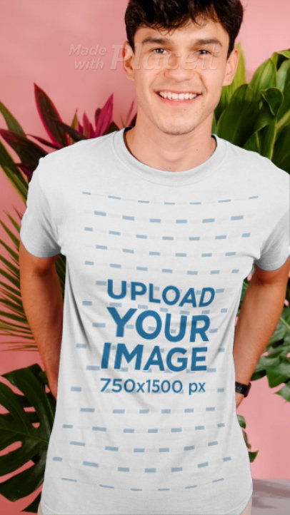 T-Shirt Video Featuring a Happy Man Posing by Tropical Plants