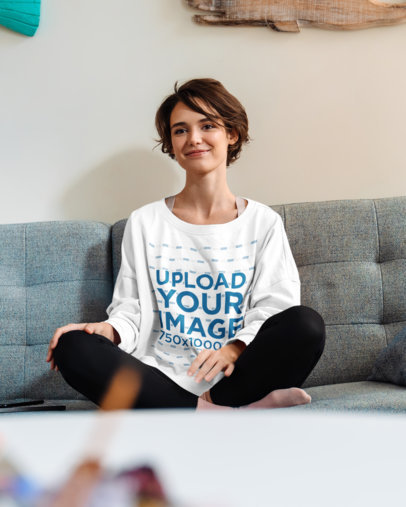 Sweatshirt Mockup of a Short-Haired Woman Sitting on a Couch