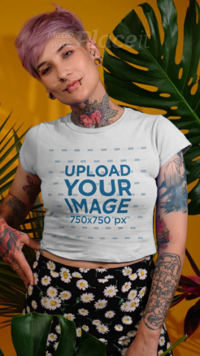 Crop Top Video of a Tattooed Woman Posing by Tropical Plants 