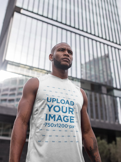 Sleeveless Shirt Mockup of a Man Standing Against a Building