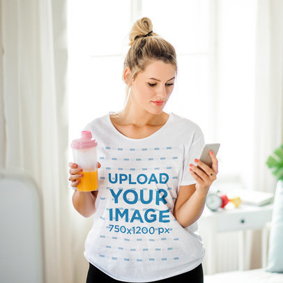 Heathered T-Shirt Mockup of a Woman Holding a Bottle of Orange Juice at Home m13382 r-el2