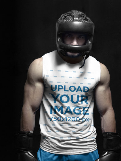 Fitness Mockup of a Boxer Standing in a Dark Room Wearing a Sleeveless Shirt