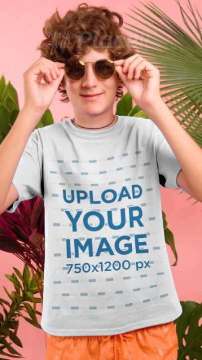 T-Shirt Video Featuring a Happy Kid With Sunglasses at a Studio
