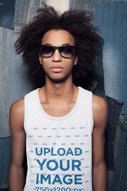 Heathered Tank Top Mockup Featuring a Teenage Boy Posing Against Denim Background