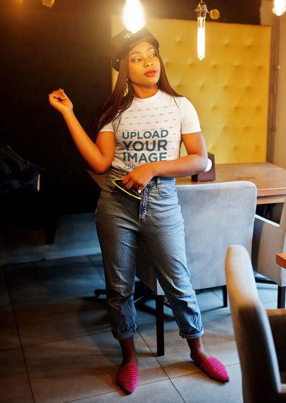 T-Shirt Mockup of a Fashionable Woman Posing in a Restaurant m5684 r-el2