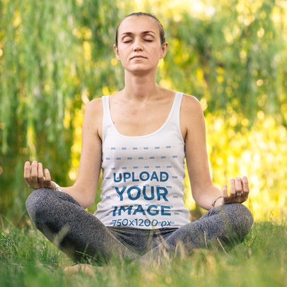 Mockup of a Woman Wearing a Tank Top While Meditating at a Park