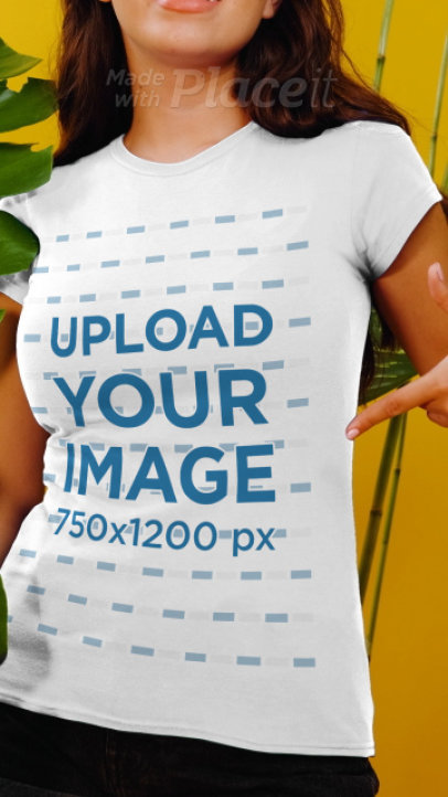 T-Shirt Video Featuring a Happy Long-Haired Woman Posing by Tropical Plants