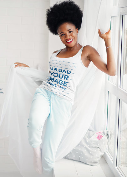 Tank Top Mockup of a Woman Having Fun With Her Bedroom Curtains