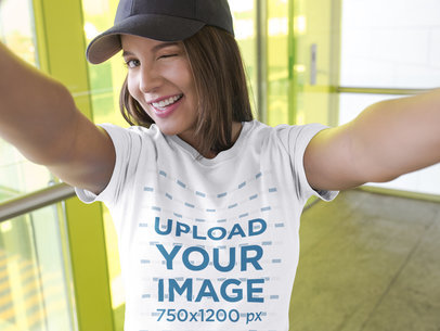 Selfie of a Beautiful Woman Wearing a T-Shirt Mockup While Smiling