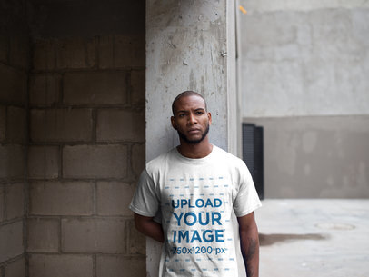 Mockup of a Man Wearing a T-Shirt While at a Warehouse Entrance a16900