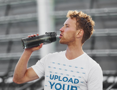 Basic T-Shirt Mockup Featuring a Serious Man Drinking Water m14814-r-el2