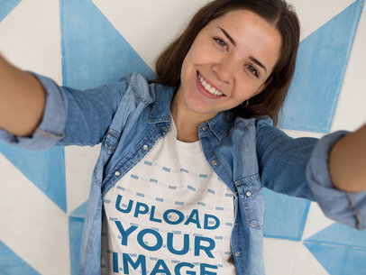 Happy Woman Taking a Selfie Against a Wall While Wearing a Tshirt Template