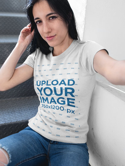 Mockup of a Serious Woman Wearing a T-Shirt While Taking a Selfie