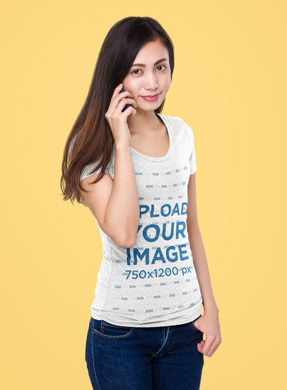 Mockup of a Long-Haired Woman in a Heathered T-Shirt Making a Call