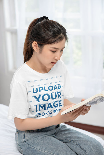 T-Shirt Mockup of a Serious Woman Reading a Book