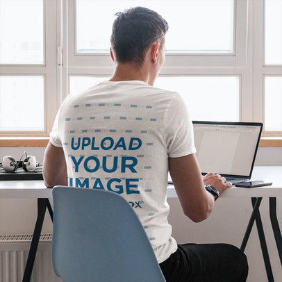 Back-View Tee Mockup of a Man Working From Home
