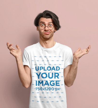T-Shirt Mockup Featuring a Confused Man With Glasses in a Studio